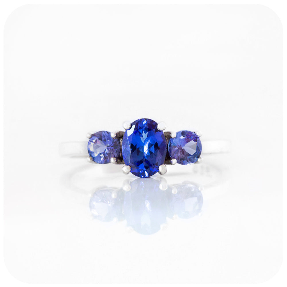 Oval and Round cut Tanzanite Trilogy Ring in Gold