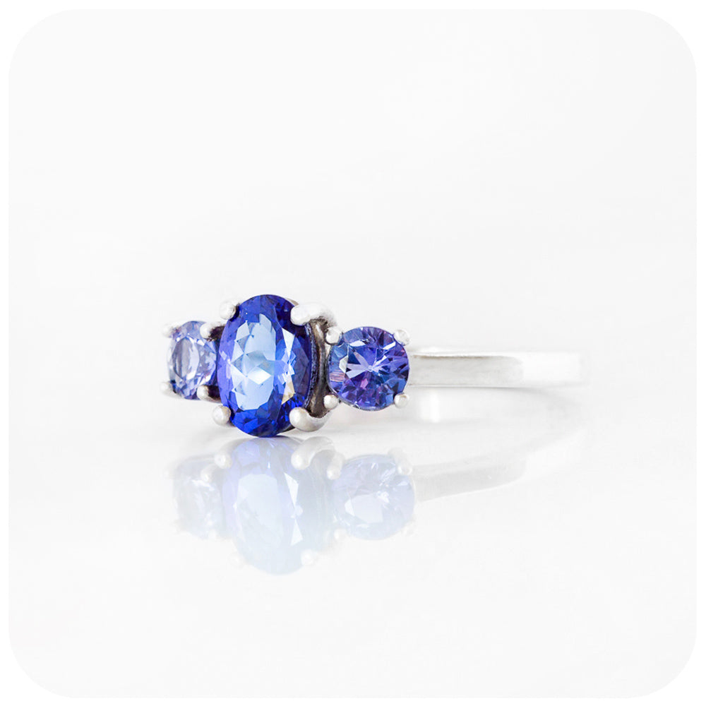 Oval and Round cut Tanzanite Trilogy Ring in Gold