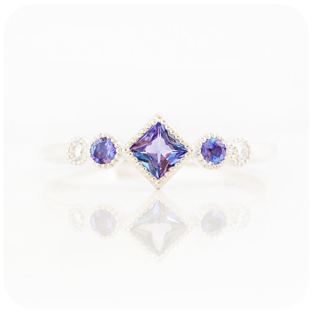 princess cut tanzanite and moissanite half eternity ring with mill grain detail - Victoria's Jewellery