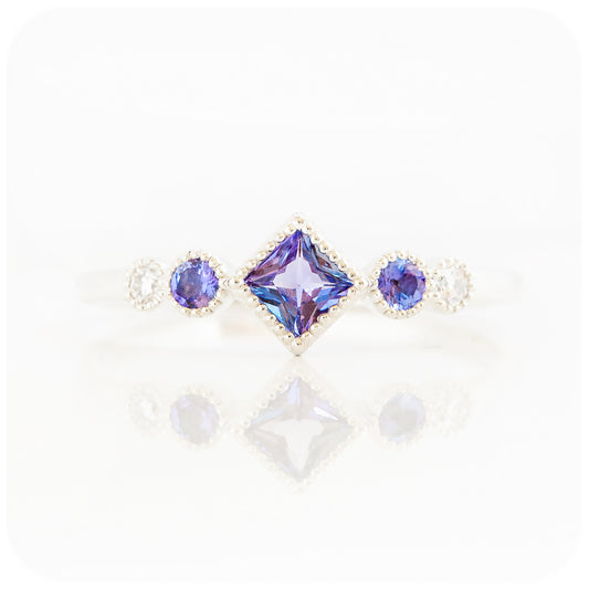 princess cut tanzanite and moissanite half eternity ring with mill grain detail - Victoria's Jewellery