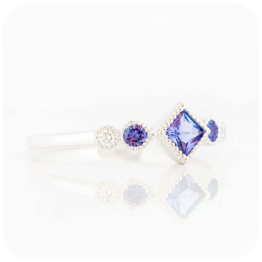 princess cut tanzanite and moissanite half eternity ring with mill grain detail - Victoria's Jewellery