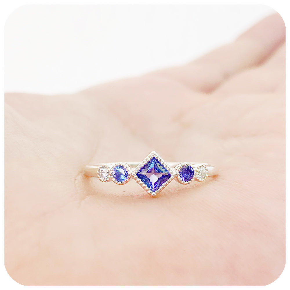 princess cut tanzanite and moissanite half eternity ring with mill grain detail - Victoria's Jewellery