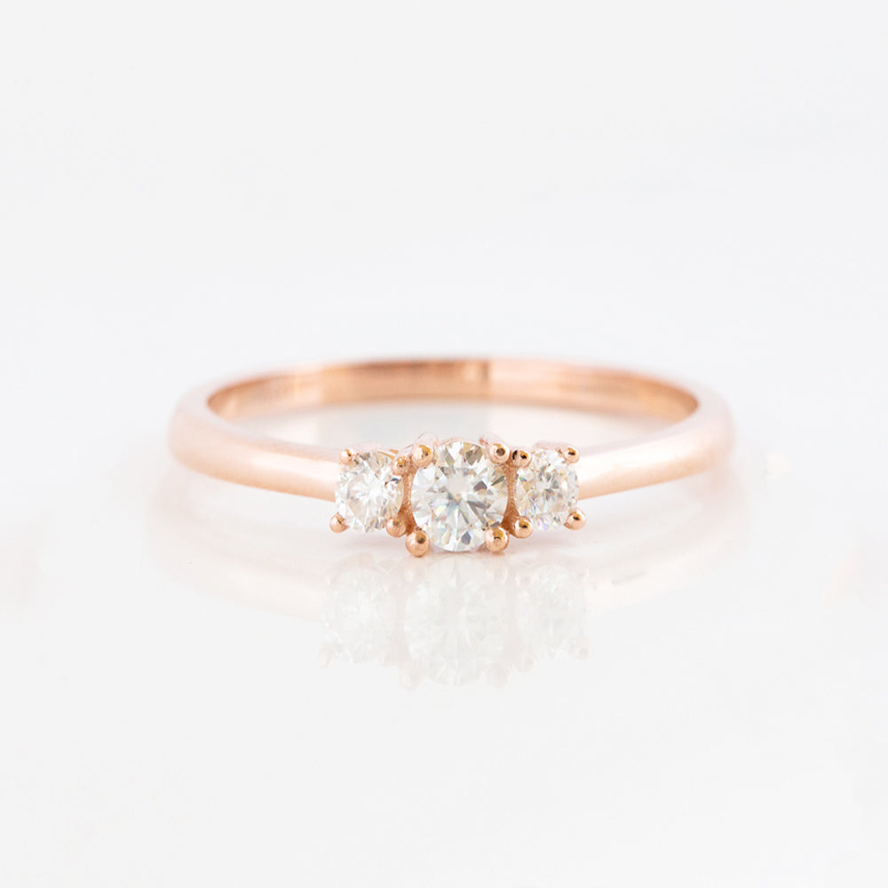 brilliant round cut moissanite trilogy engagement ring in rose gold - Victoria's Jewellery