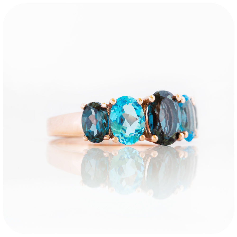 Oval cut Graduated London and Swiss Blue Topaz Anniversary or November Birthstone Ring in Rose Gold - Victoria's Jewellery