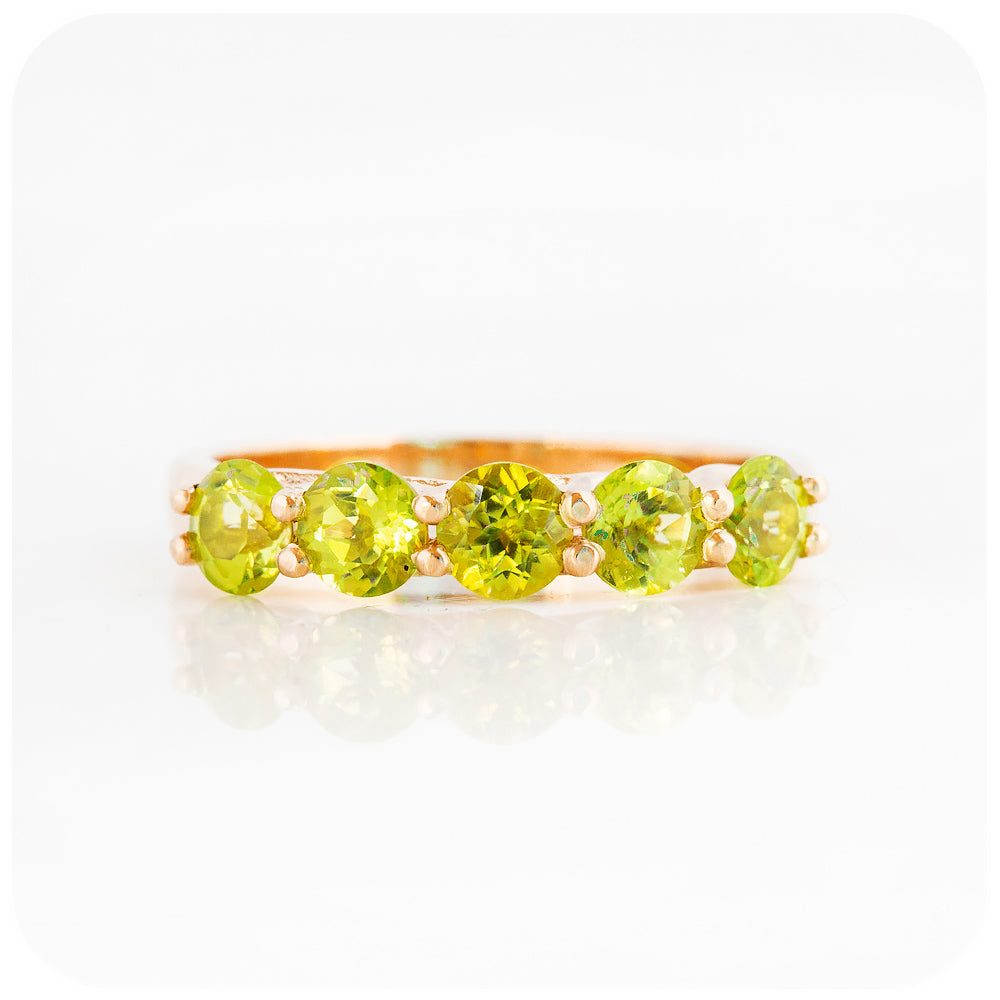 Danelle, a Peridot Half Eternity Trellis Ring