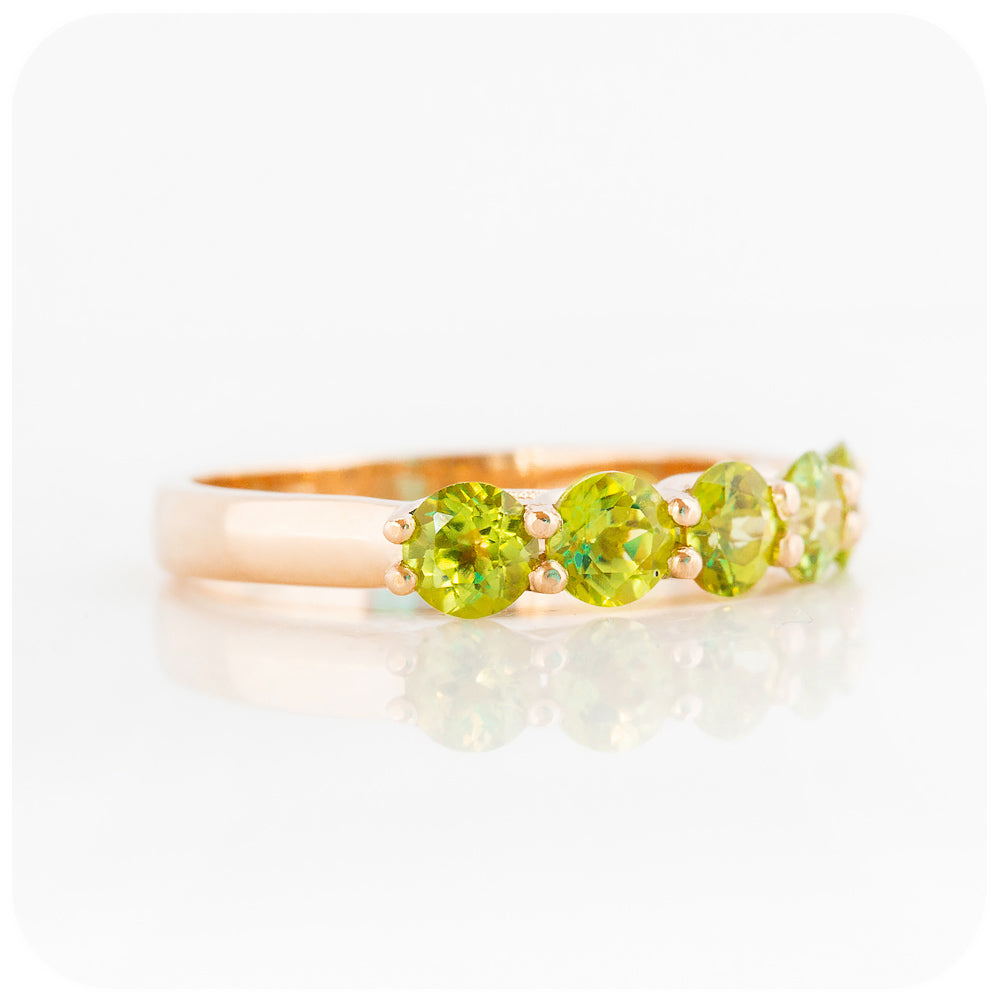 Danelle, a Peridot Half Eternity Trellis Ring