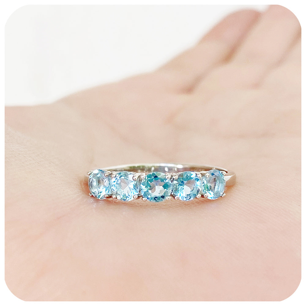 Annie, an Aquamarine Half Eternity Ring
