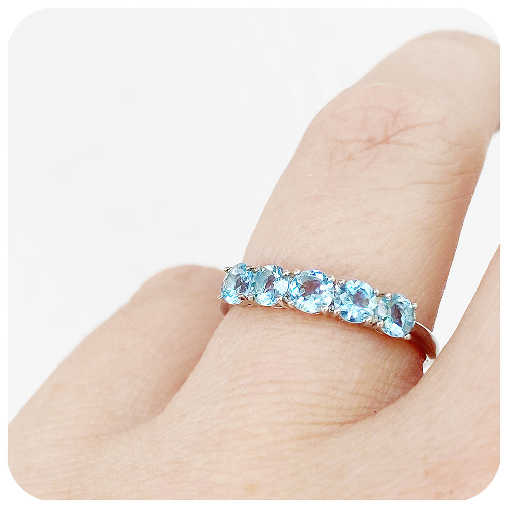 Annie, an Aquamarine Half Eternity Ring