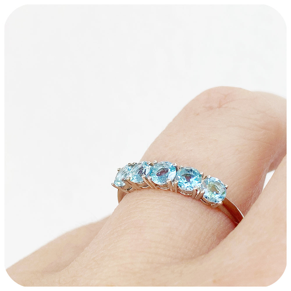 Annie, an Aquamarine Half Eternity Ring