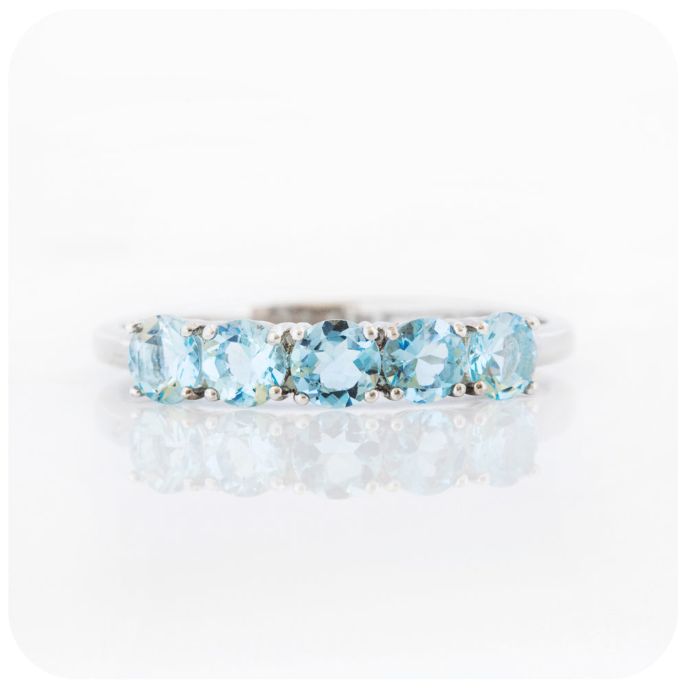 Annie, an Aquamarine Half Eternity Ring