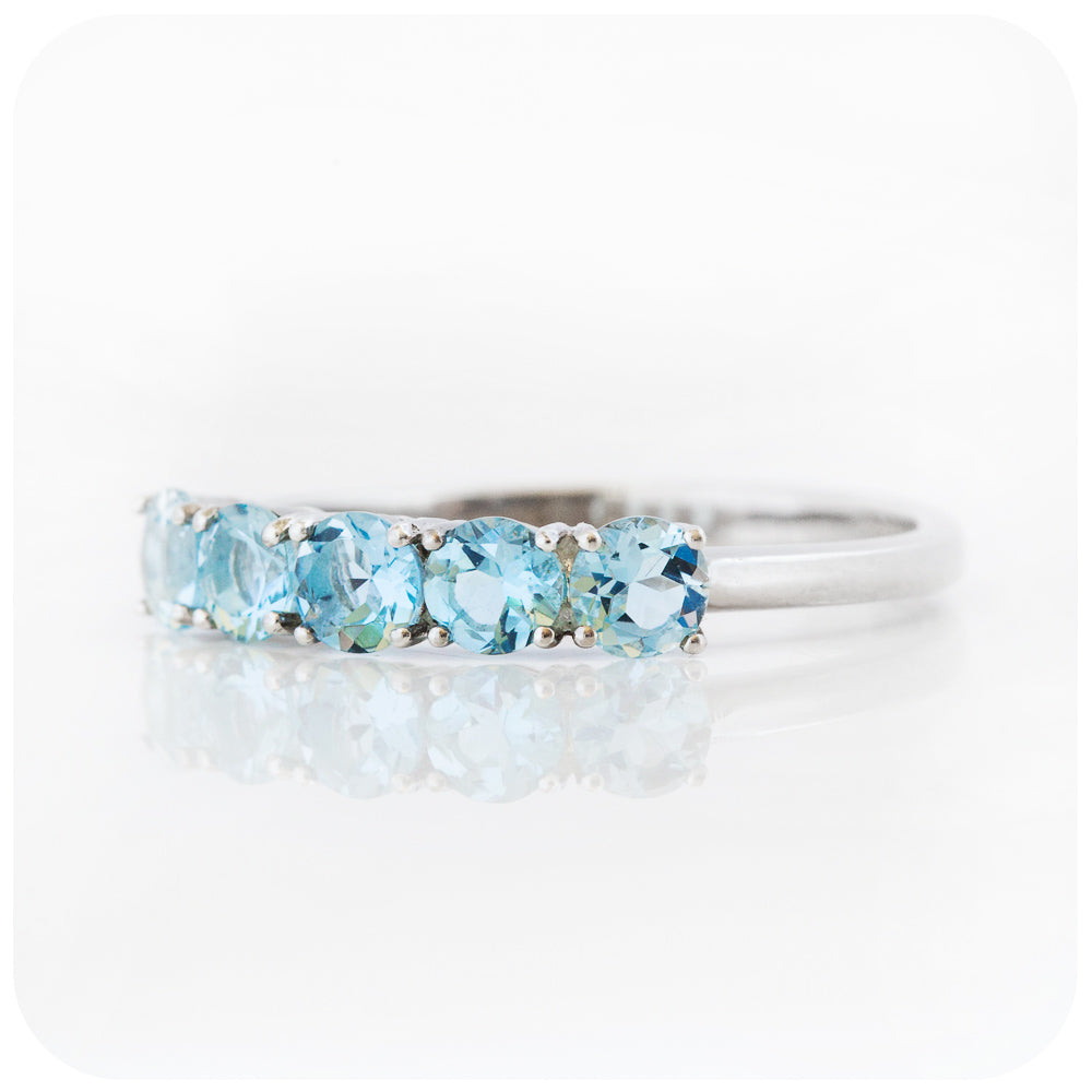 Annie, an Aquamarine Half Eternity Ring