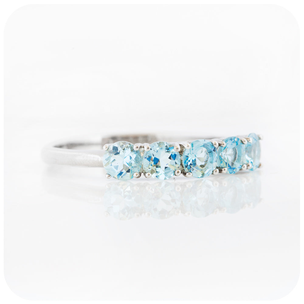 Annie, an Aquamarine Half Eternity Ring
