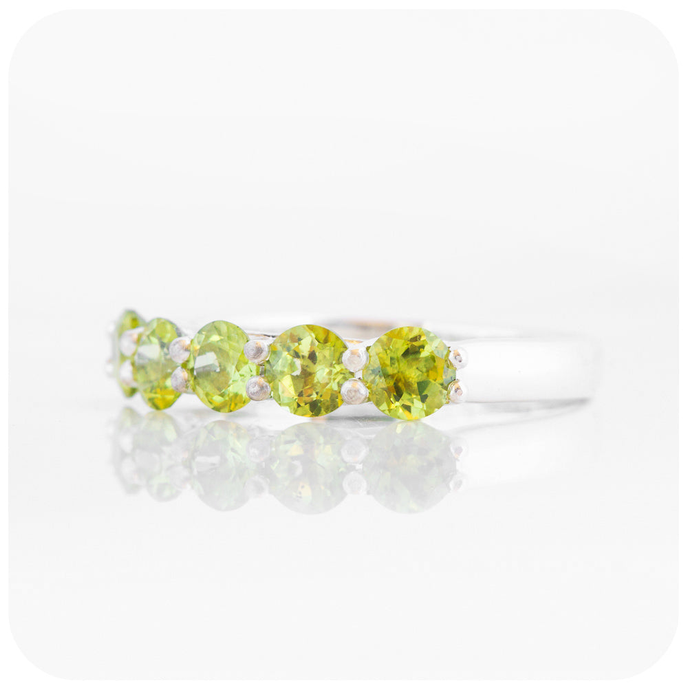 Danelle, a Peridot Half Eternity Trellis Ring