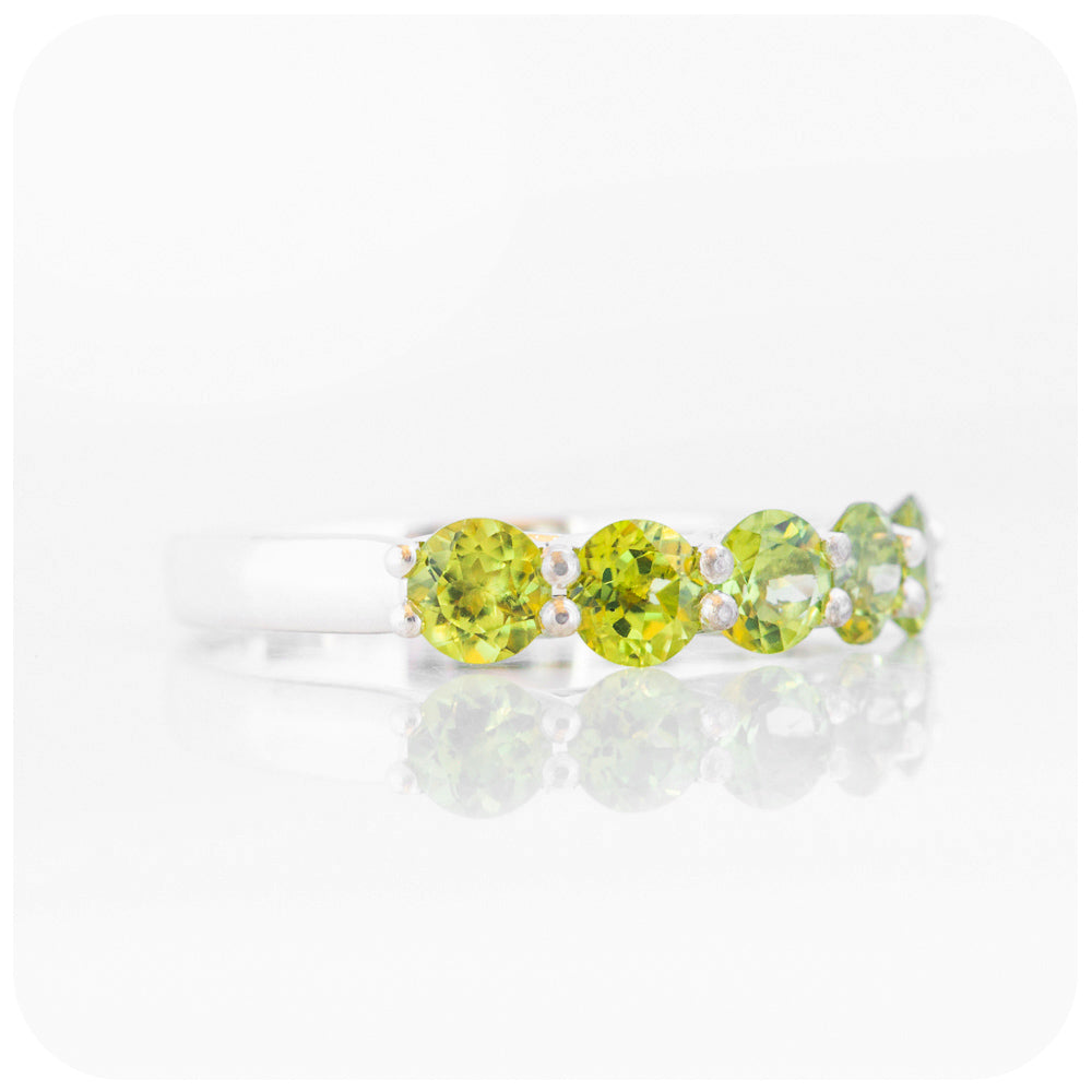 Danelle, a Peridot Half Eternity Trellis Ring