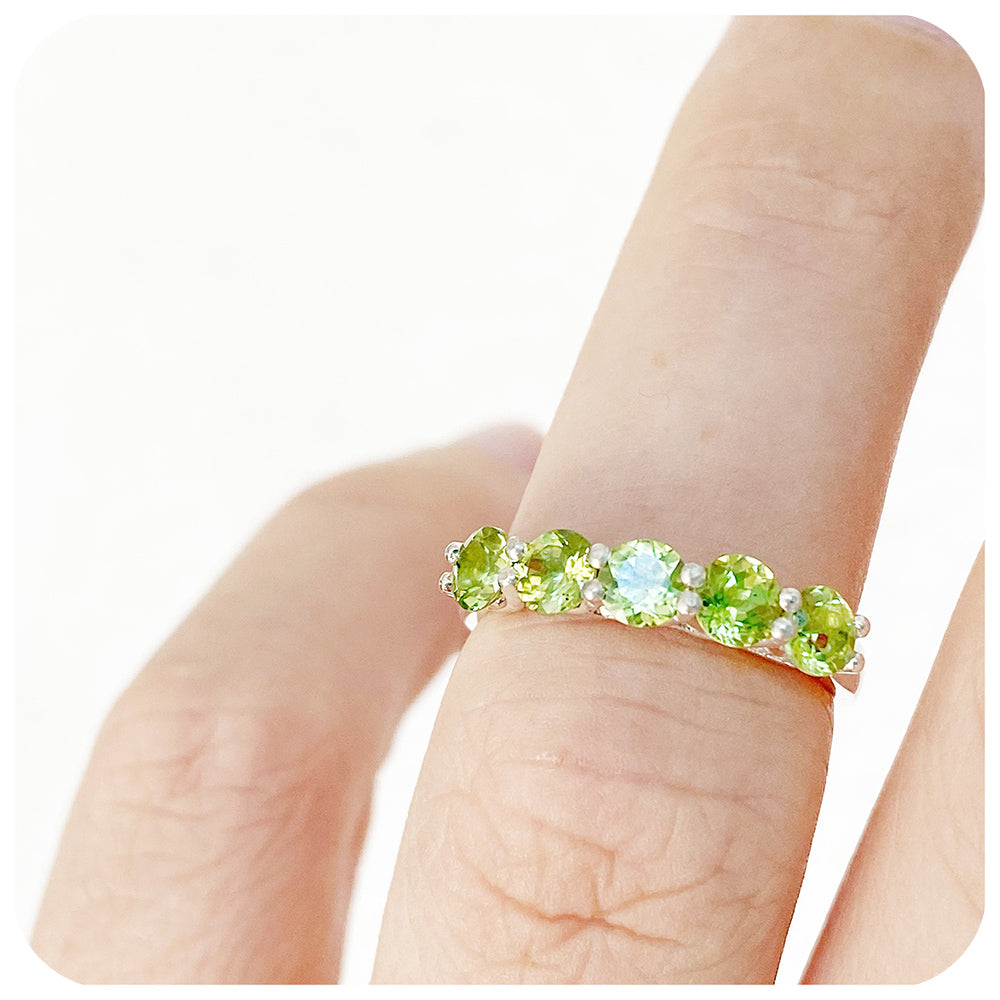 Danelle, a Peridot Half Eternity Trellis Ring
