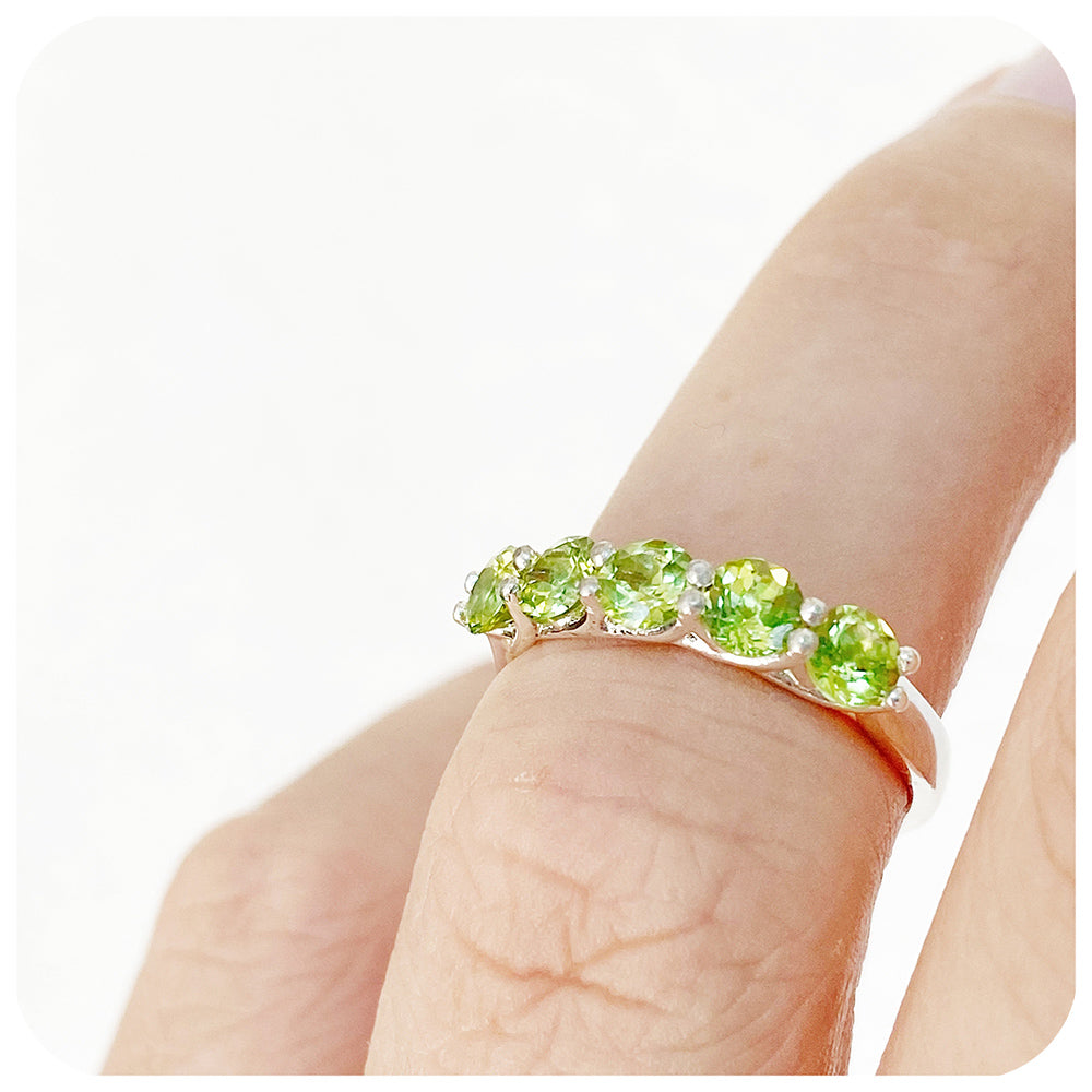 Danelle, a Peridot Half Eternity Trellis Ring