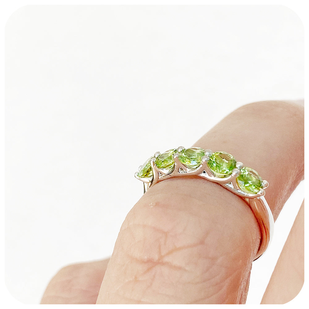 Danelle, a Peridot Half Eternity Trellis Ring