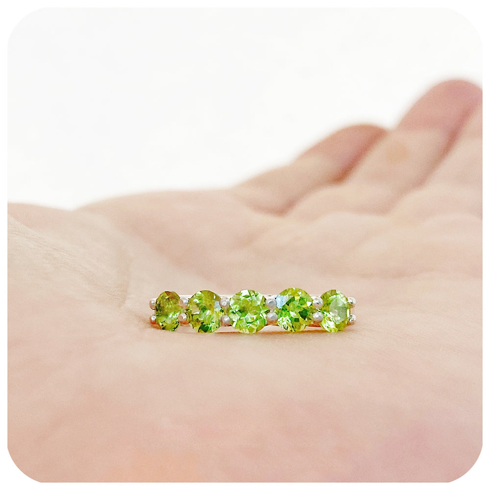 Danelle, a Peridot Half Eternity Trellis Ring