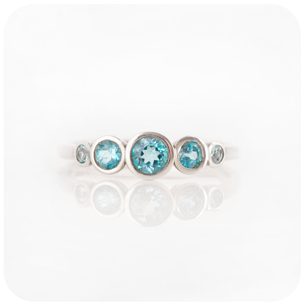 Gabriella, a Swiss Blue Topaz Half Eternity Ring