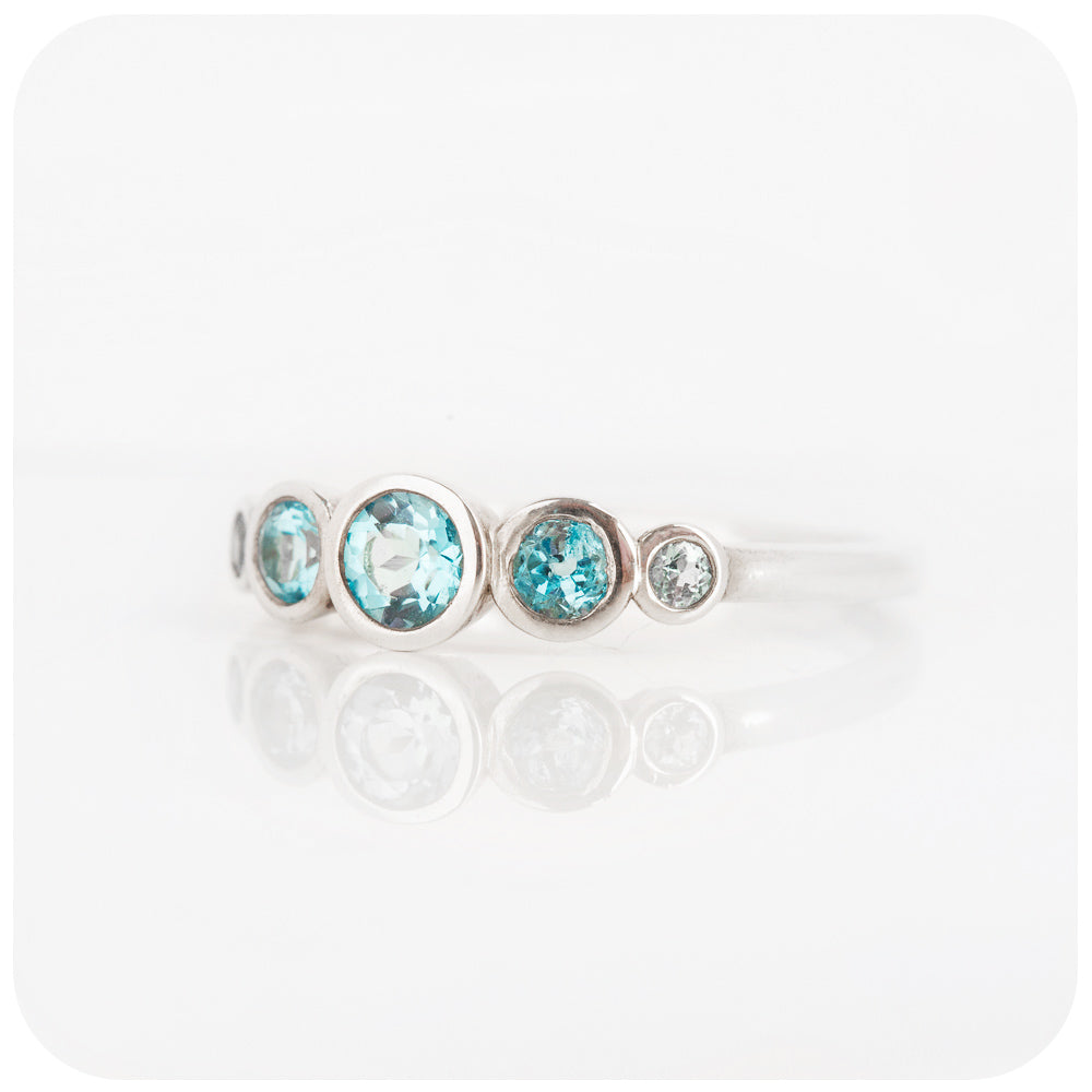 Gabriella, a Swiss Blue Topaz Half Eternity Ring