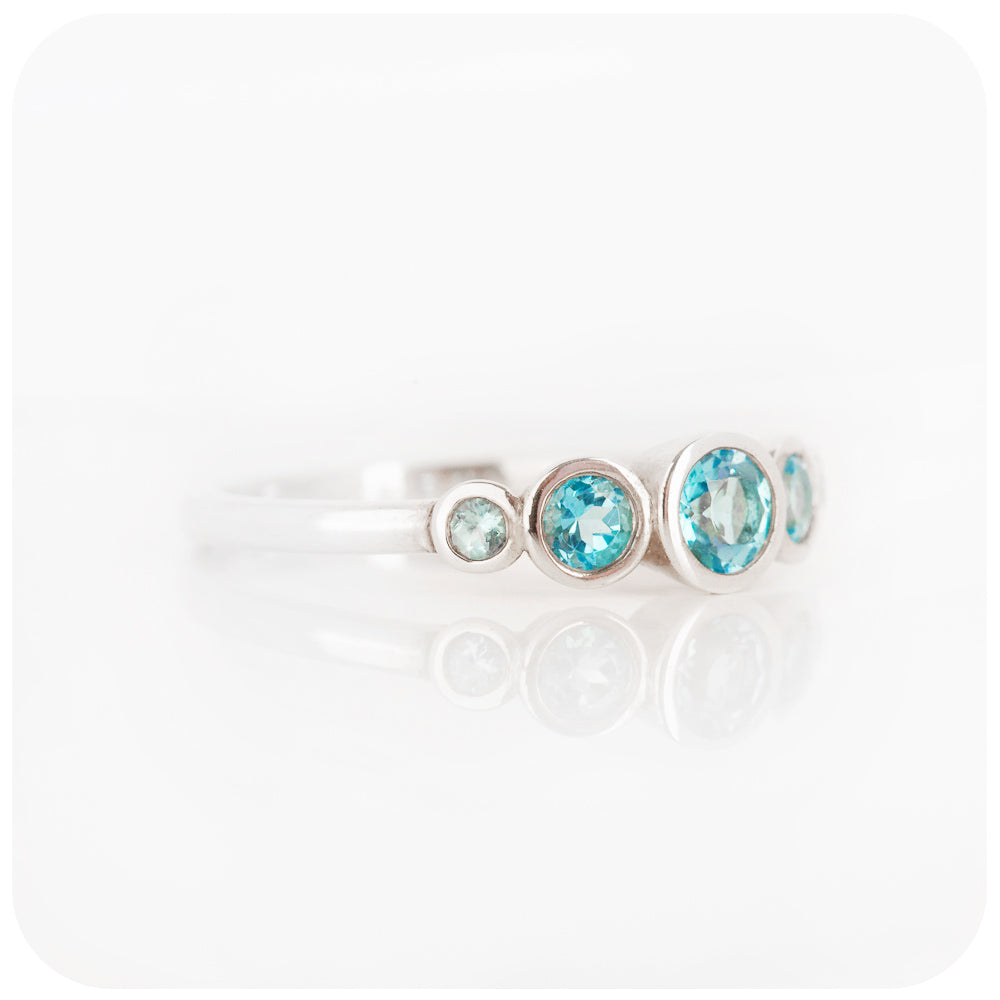 Gabriella, a Swiss Blue Topaz Half Eternity Ring