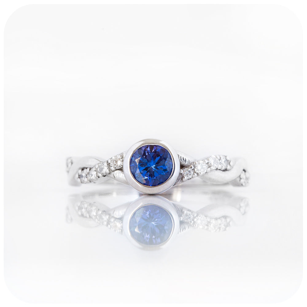 tanzanite and moissanite infinity style wedding ring