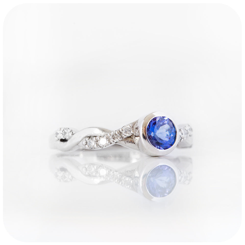 tanzanite and moissanite infinity style wedding ring