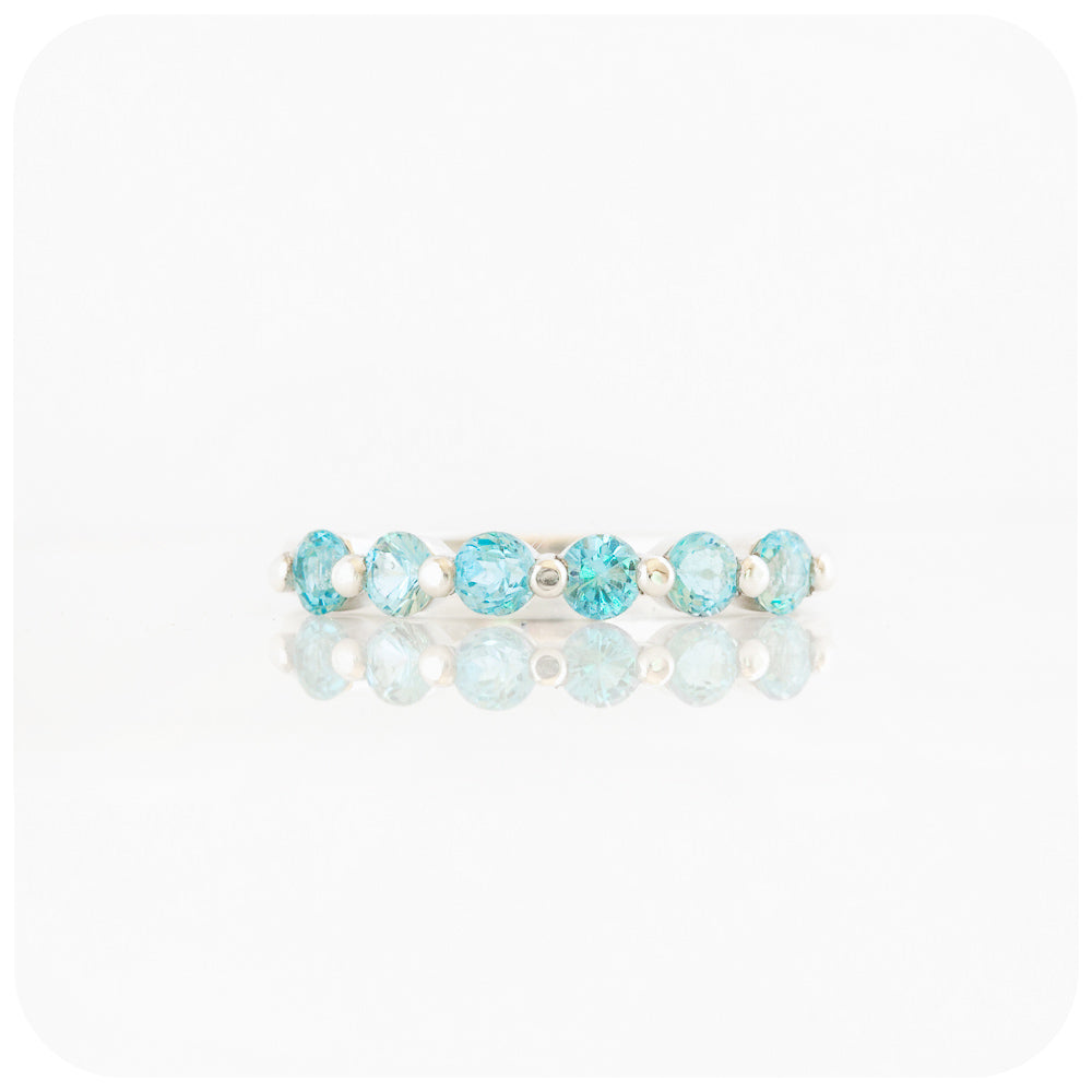 Ellie, a Swiss Blue Topaz Six Stone Half Eternity Ring