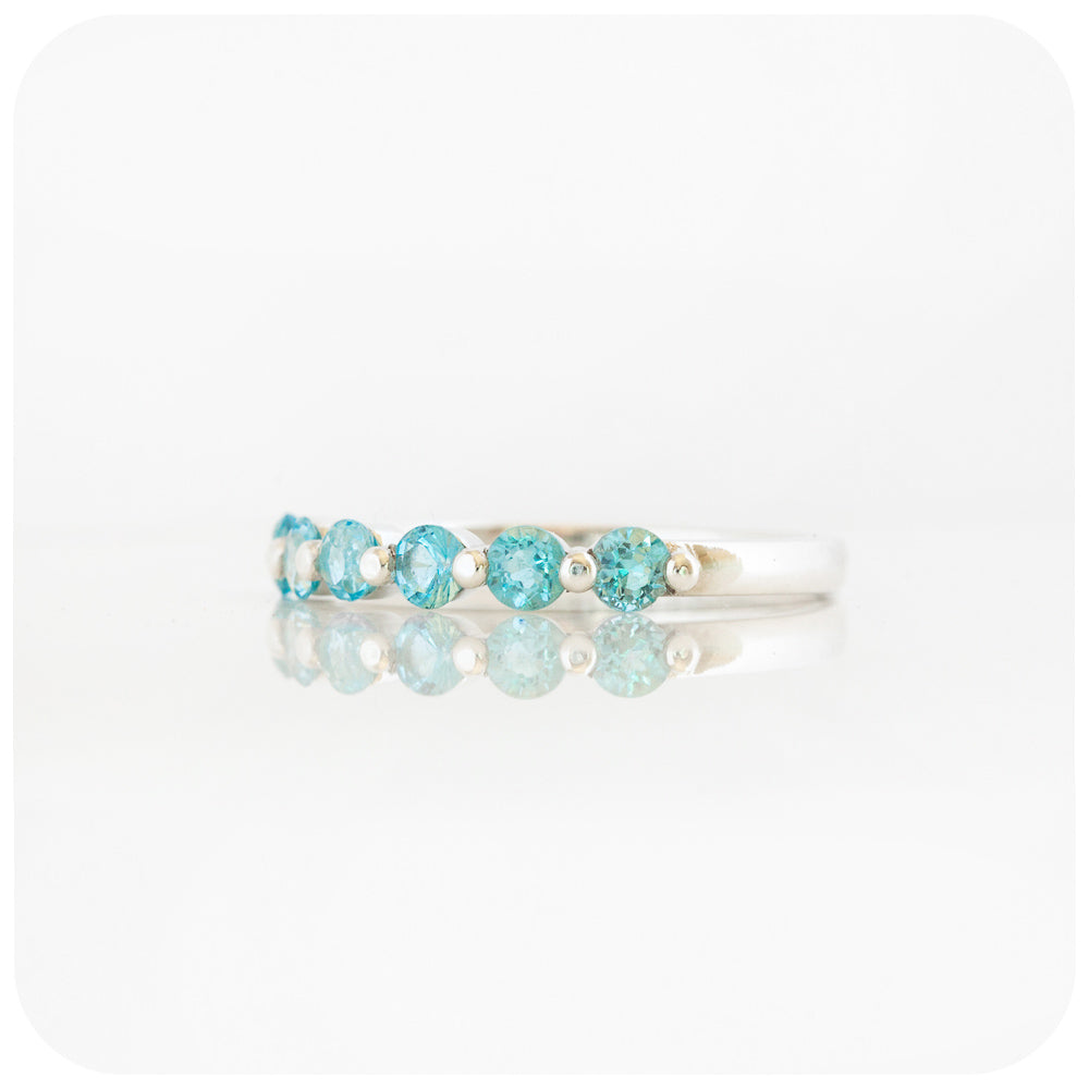 Ellie, a Swiss Blue Topaz Six Stone Half Eternity Ring