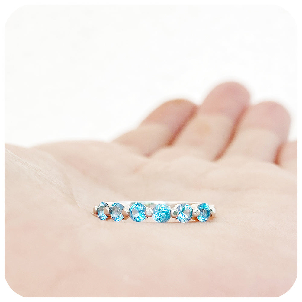 Ellie, a Swiss Blue Topaz Six Stone Half Eternity Ring