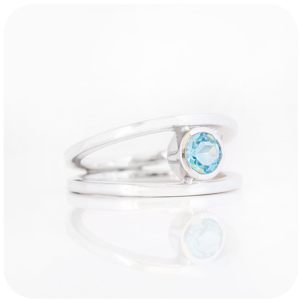 Round cut Swiss Blue Topaz Ring with a Split Band Design in Sterling Silver
