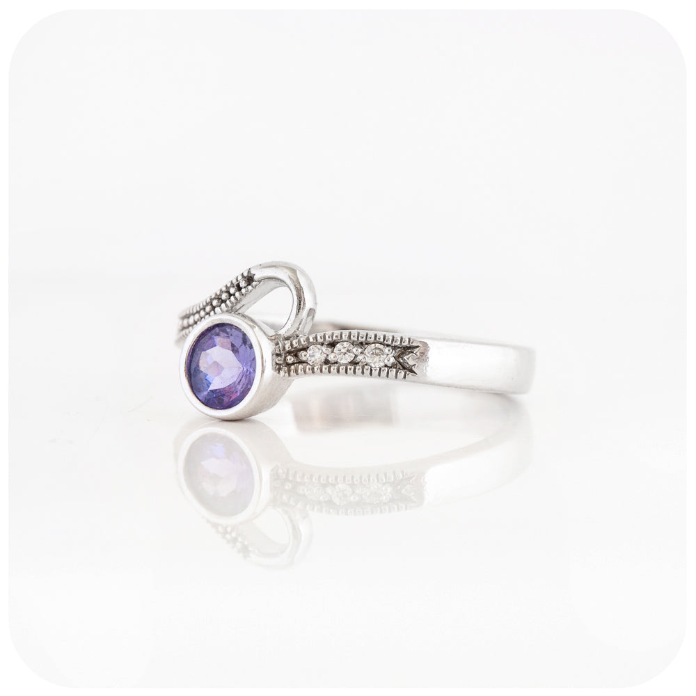Round cut tanzanite and cubic zirconia dress ring