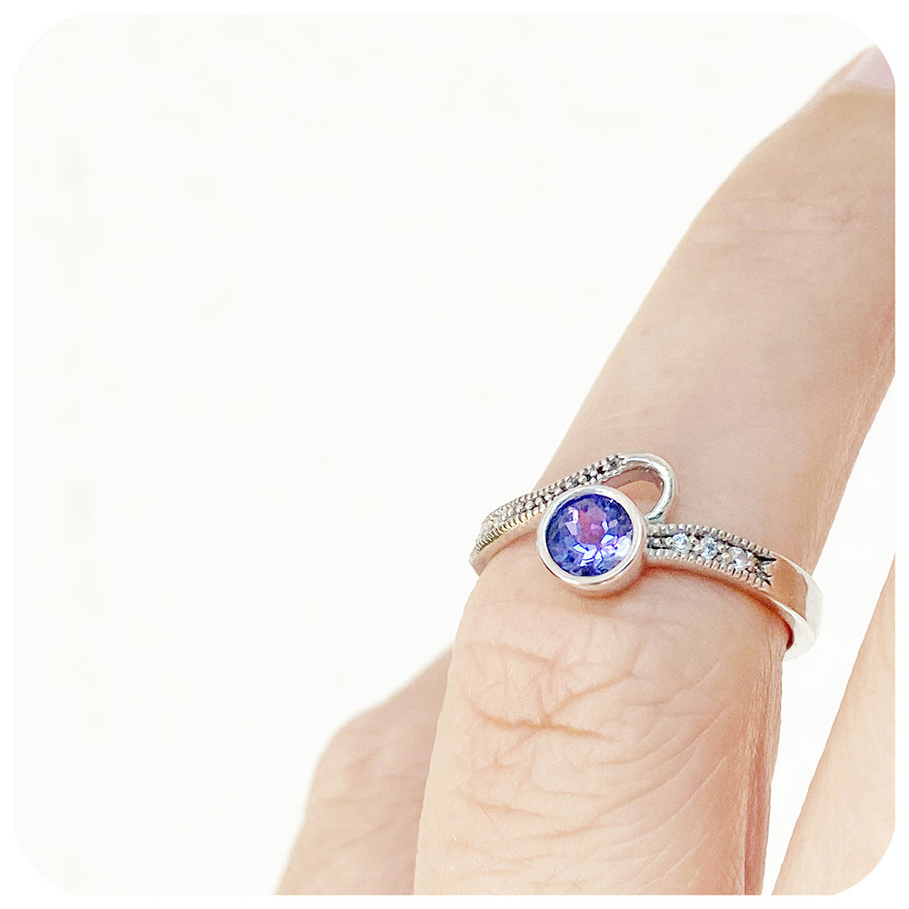 Round cut tanzanite and cubic zirconia dress ring