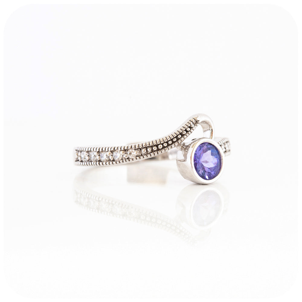 Round cut tanzanite and cubic zirconia dress ring