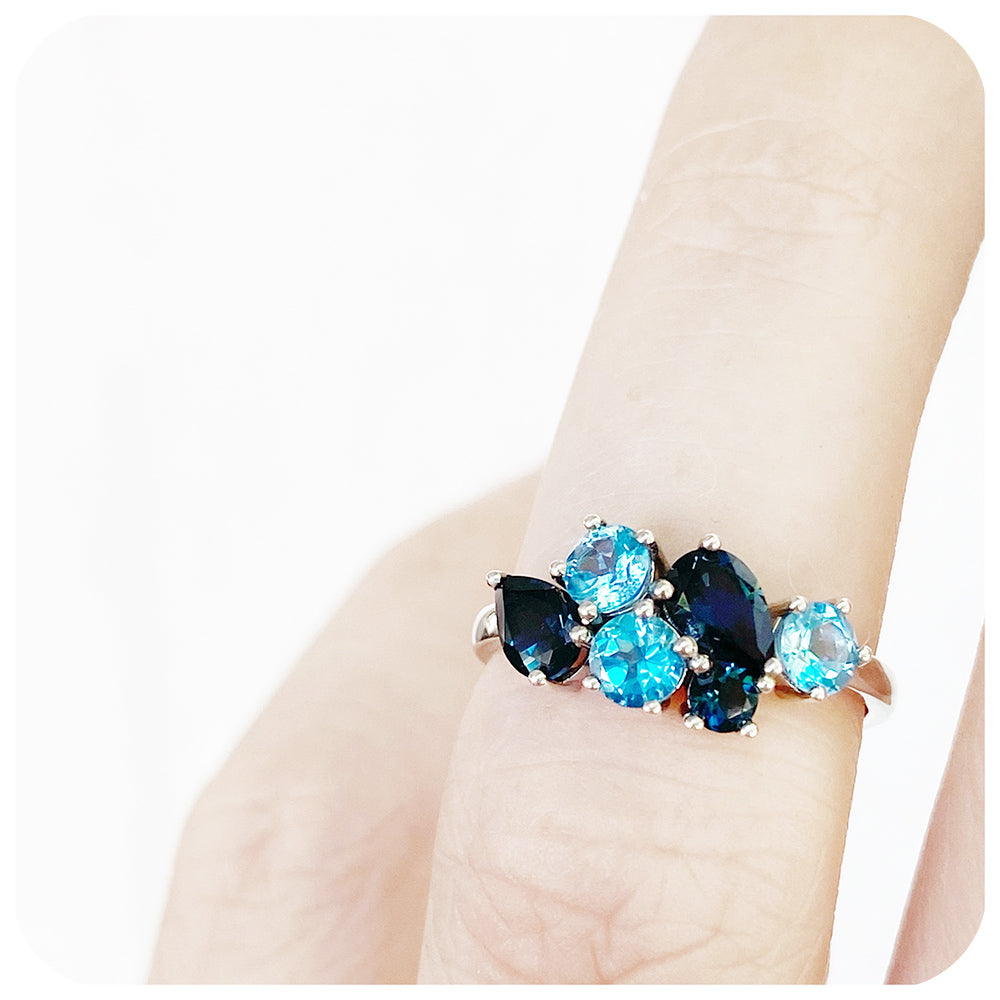The Ena, a Cluster Ring with London and Swiss Blue Topaz