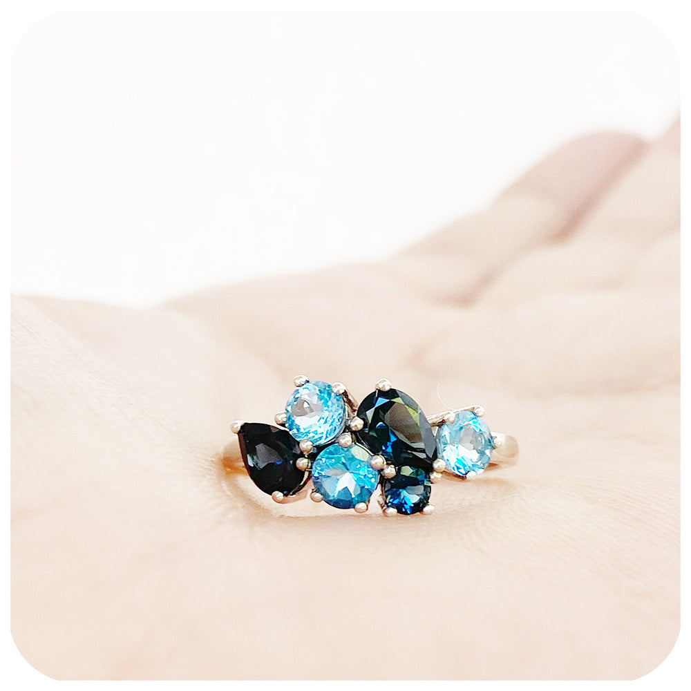 The Ena, a Cluster Ring with London and Swiss Blue Topaz