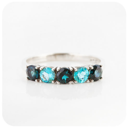 brilliant cut blue topaz half eternity anniversary or birthstone ring