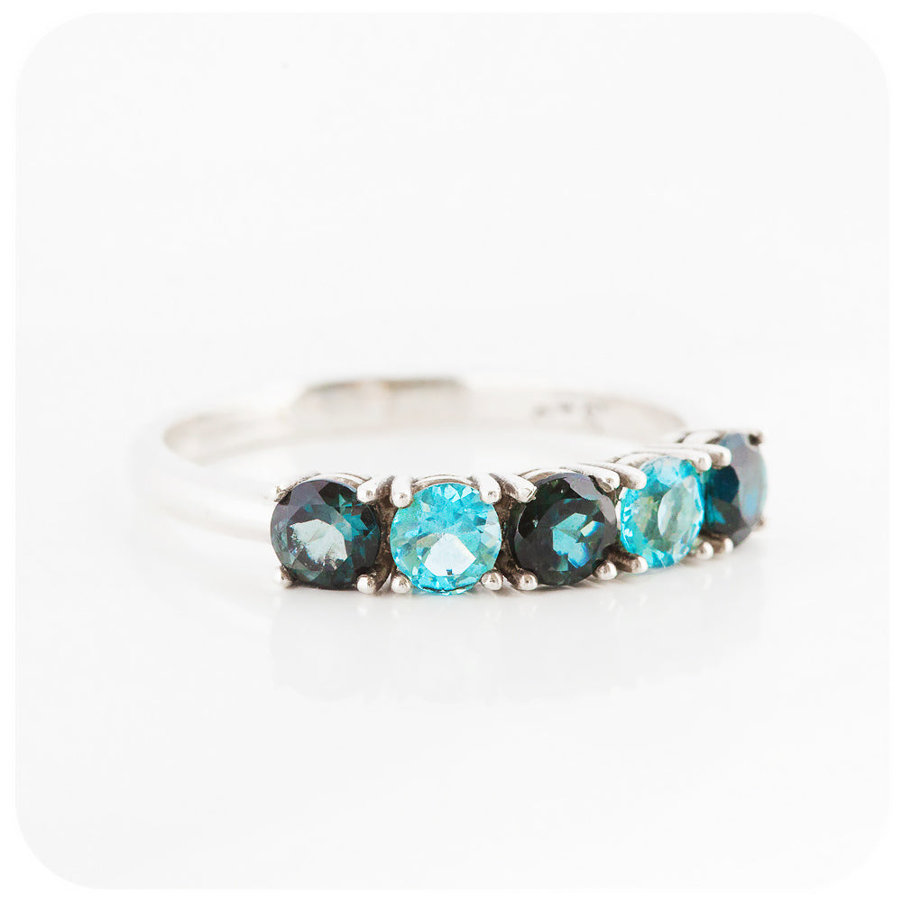 brilliant cut blue topaz half eternity anniversary or birthstone ring