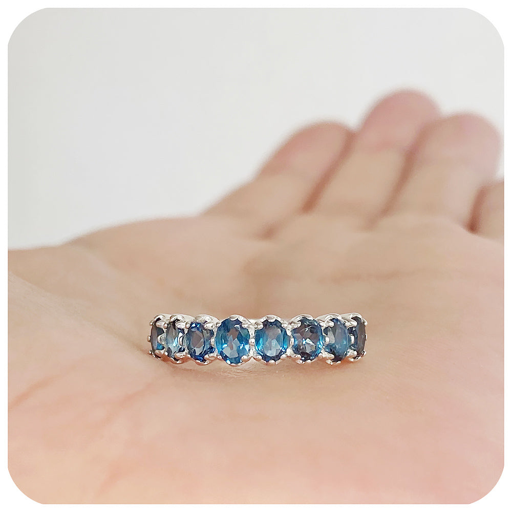 Oval cut London Blue Topaz Half Eternity Ring in Sterling Silver