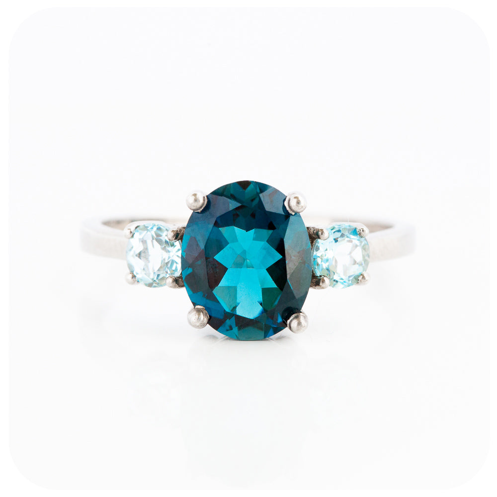 Oval cut London Blue Topaz and Sky Blue Topaz Trilogy Anniversary Ring - Victoria's Jewellery