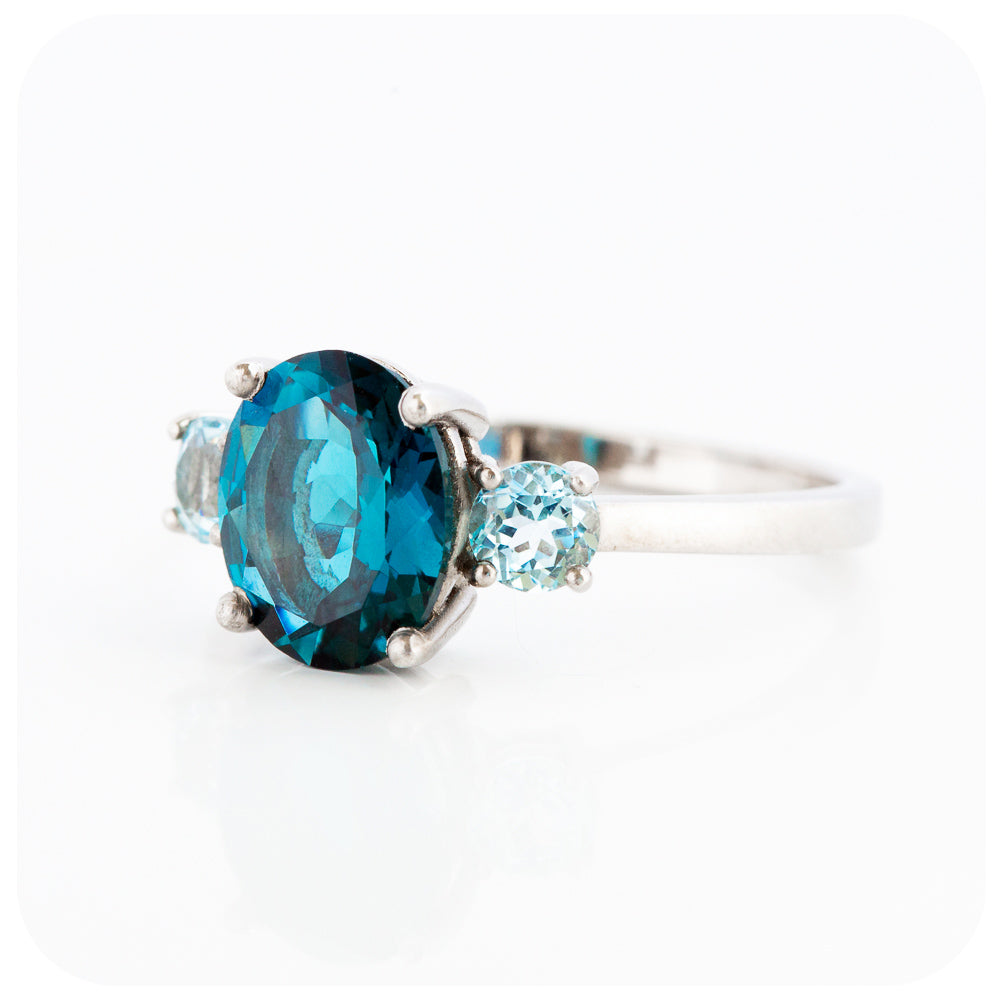 Oval cut London Blue Topaz and Sky Blue Topaz Trilogy Anniversary Ring - Victoria's Jewellery