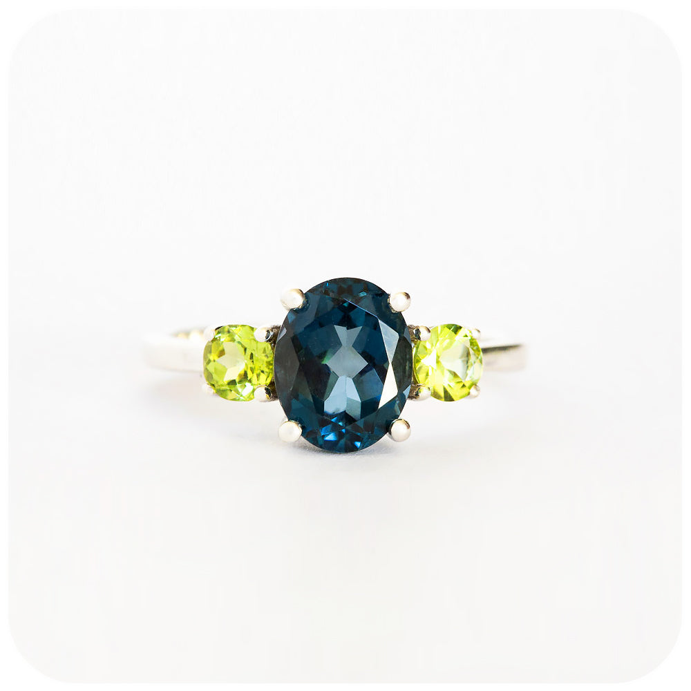 Oval cut London Blue Topaz and Peridot Trilogy Anniversary Ring - Victoria's Jewellery