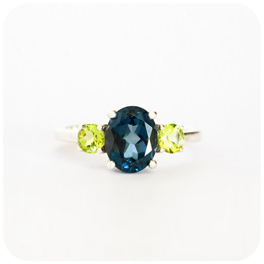 Oval cut London Blue Topaz and Peridot Trilogy Anniversary Ring - Victoria's Jewellery