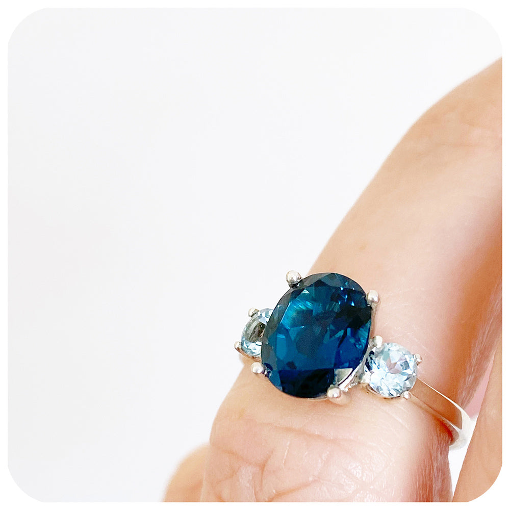 Oval cut London Blue Topaz and Sky Blue Topaz Trilogy Anniversary Ring - Victoria's Jewellery