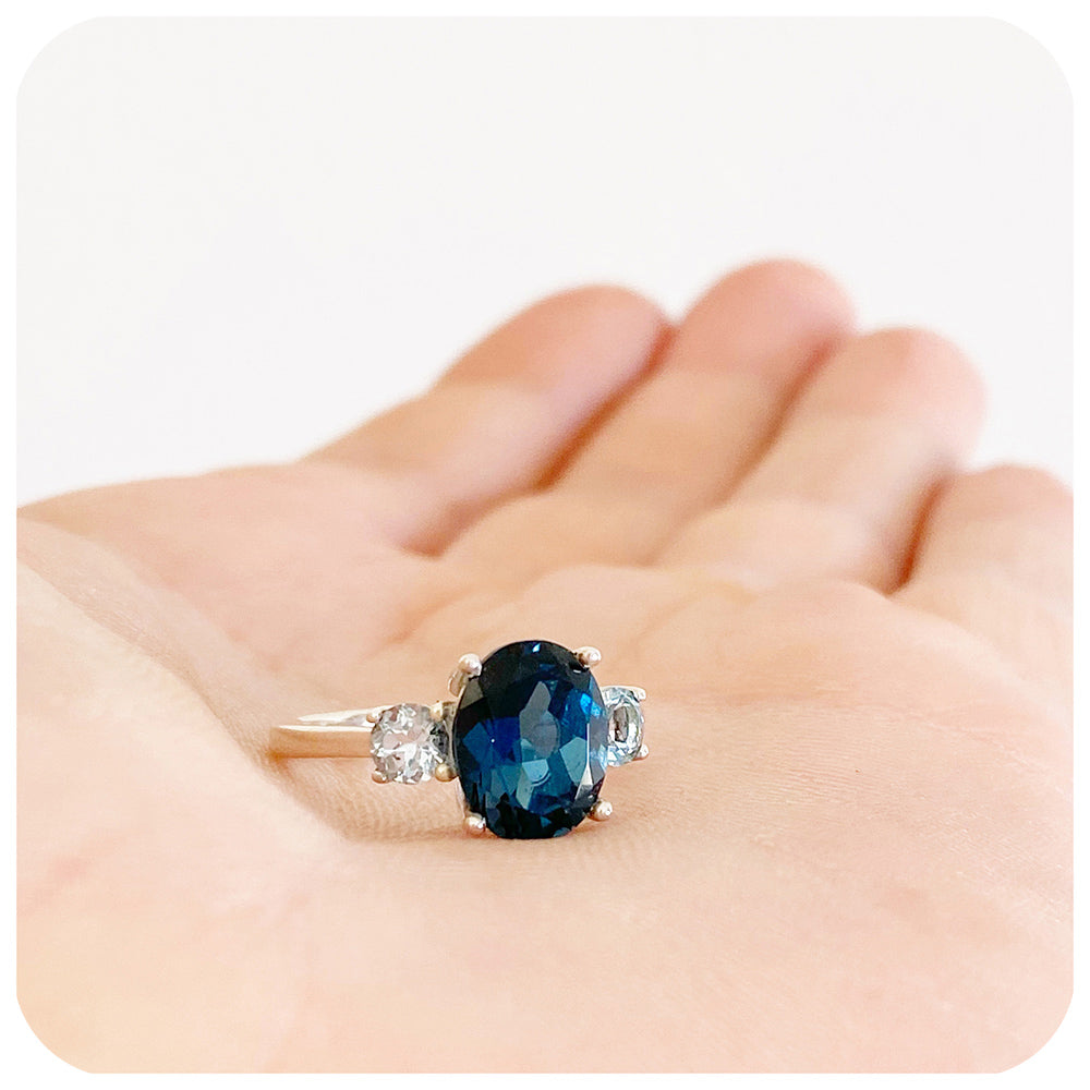 Oval cut London Blue Topaz and Sky Blue Topaz Trilogy Anniversary Ring - Victoria's Jewellery