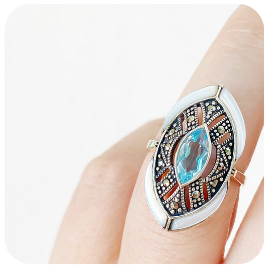 mother of pearl and blue topaz cocktail ring