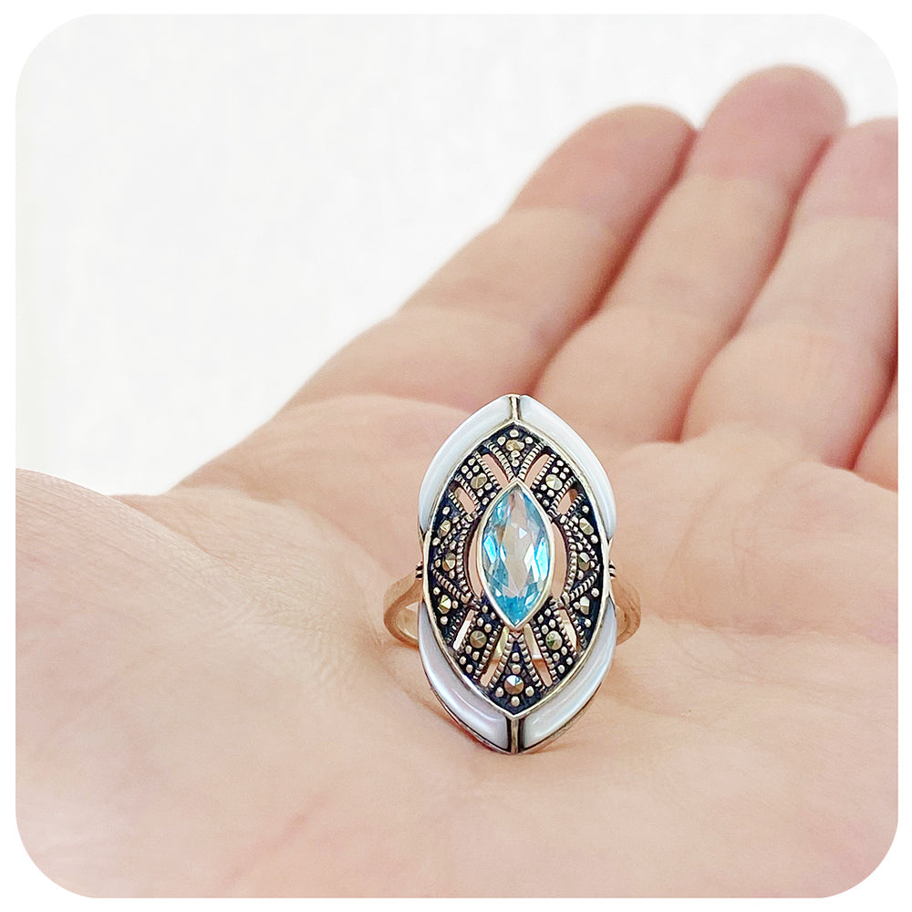 mother of pearl and blue topaz cocktail ring