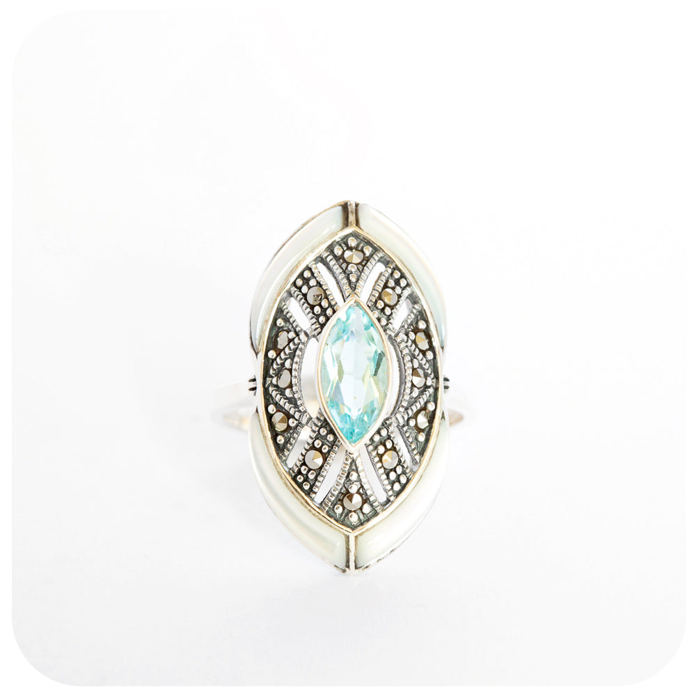 mother of pearl and blue topaz cocktail ringmother of pearl and blue topaz cocktail ring