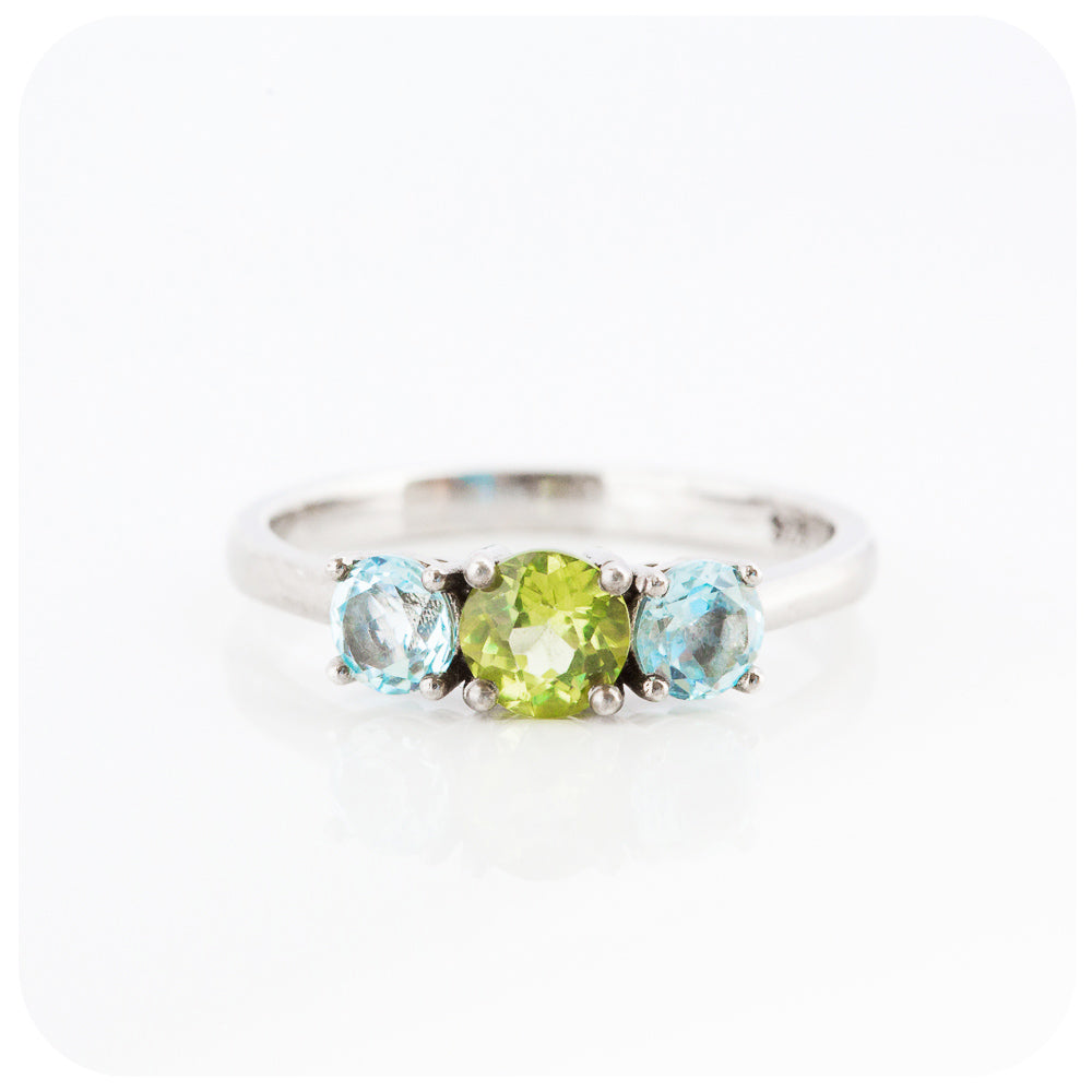 Peridot and Sky Blue Topaz Round cut Trilogy Ring