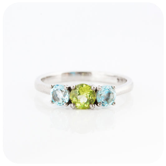 Peridot and Sky Blue Topaz Round cut Trilogy Ring